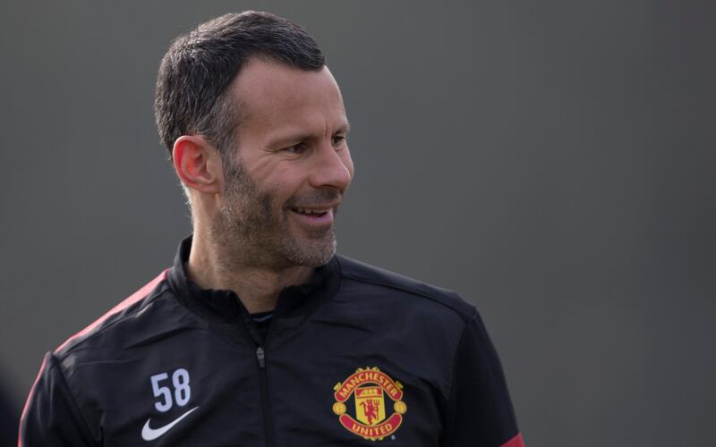 Manchester United's Ryan Giggs smiles as he trains with teammates at Carrington training ground in Manchester, Monday, March 4, 2013. Manchester United will play Real Madrid in a Champion's League round of 16 soccer match on Tuesday. (AP Photo/Jon Super)   *** Local Caption ***  Britain Soccer Champions League.JPEG-0da68.jpg