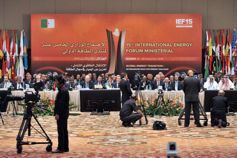 Energy ministers from Opec and other oil-producing countries attend the opening session of the International Energy Forum in Algiers, Algeria. Sidali Djarboub / AP Photo