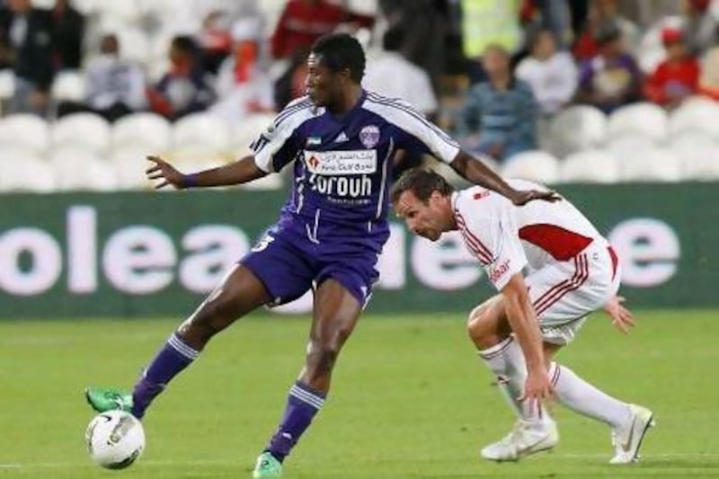 Asamoah Gyan, left, will be aiming to fire Al Ain to the Pro League title with a victory over Al Jazira tomorrow. Mike Young / The National