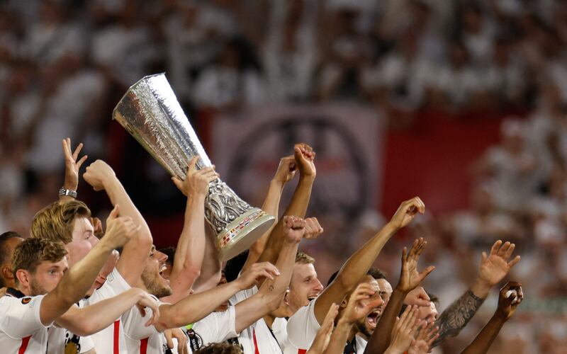 Eintracht Frankfurt's Sebastian Rode lifts the trophy as they celebrate after winning the Europa League. Reuters