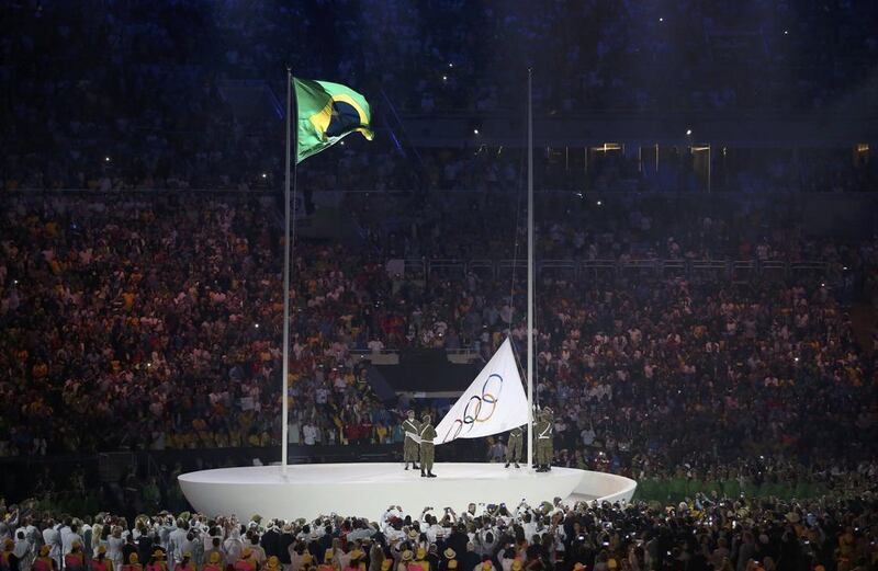 The Olympic flag is raised during the opening ceremony. Issei Kato / Reuters