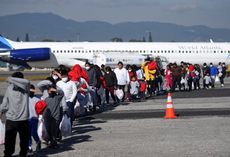 Guatemalan migrants arrive on a deportation flight from the US, at La Aurora Air Force Base in Guatemala City. Reuters
