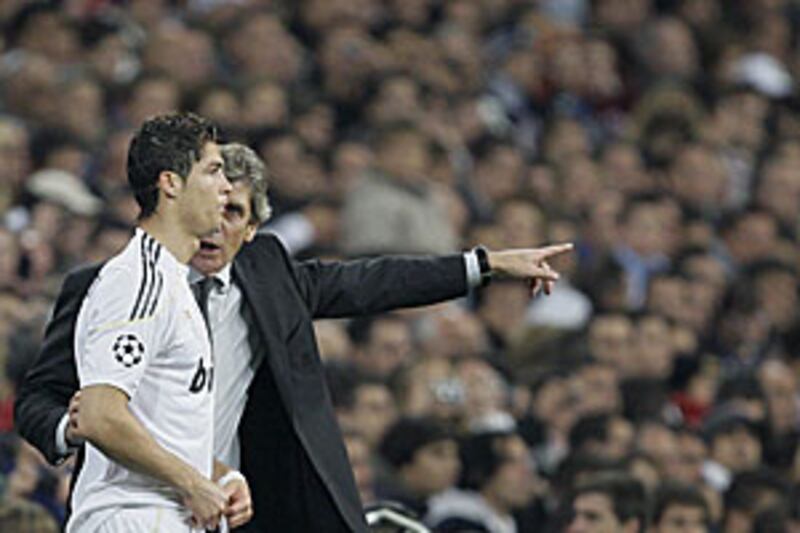 Real's coach Manuel Pellegrini, right, gives instructions to Cristiano Ronaldo on Wednesday.