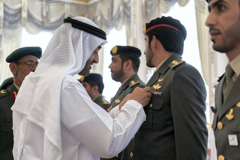 Sheikh Mohamed bin Zayed affixes a medal of honour to a member of the UAE Armed Forces on Monday. Courtesy Sheikh Mohamed bin Zayed Twitter