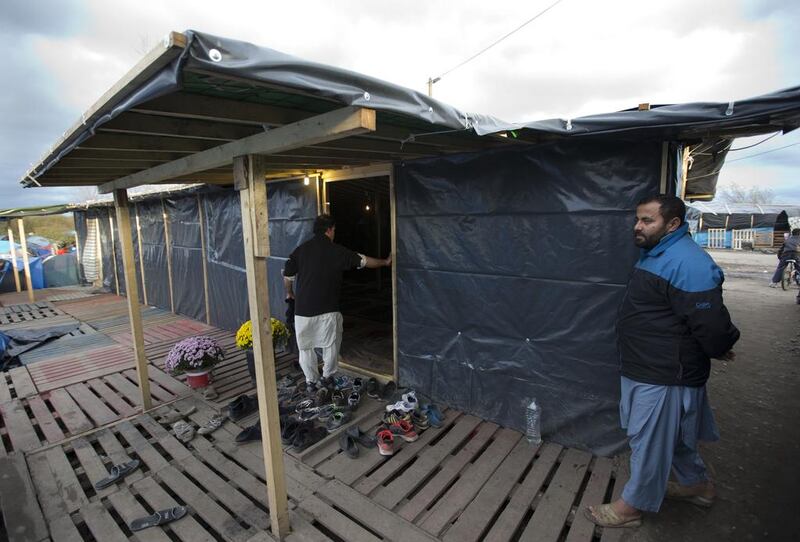 Tarpaulin covers a makeshift mosque. Stephen Lock for The National