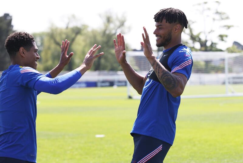 MIDDLESBROUGH, ENGLAND - JUNE 01: Jude Bellingham and Tyrone Mings of England laugh during a training session at an England Pre-Euro 2020 Training Camp on June 01, 2021 in Middlesbrough, England. (Photo by Eddie Keogh - The FA/The FA via Getty Images)