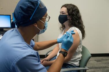 A first shot of the Sinopharm vaccine is given following an assessment of the patient’s health. AFP