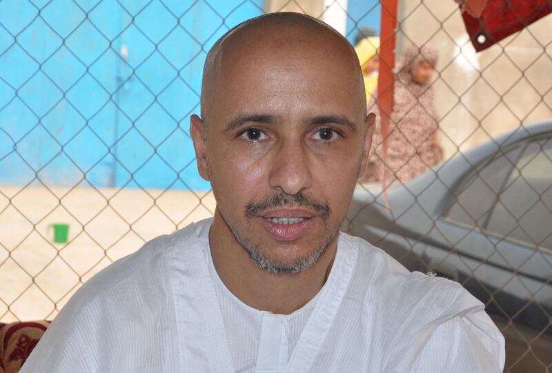 Mohamedou Ould Slahi, a Guantanamo Bay prisoner who wrote a best-selling book about his experiences in the military prison, poses on October 18, 2016 in Nouakchott, after he was reunited with his family in his native Mauritania on October 17 after 14 years of detention - The transfer of Mohamedou Ould Slahi, believed to be the last inmate from Mauritania held at the facility in Cuba, brings the prison's remaining population down to 60. His case became a cause celebre after the publication last year of "Guantanamo Diary", in which he outlines his treatment at the notorious US naval base in Cuba and says he was subjected to torture. (Photo by STRINGER / AFP)