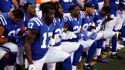 Indianapolis Colts players kneel during the playing of the US national anthem in September 2017. Brian Spurlock / USA Today