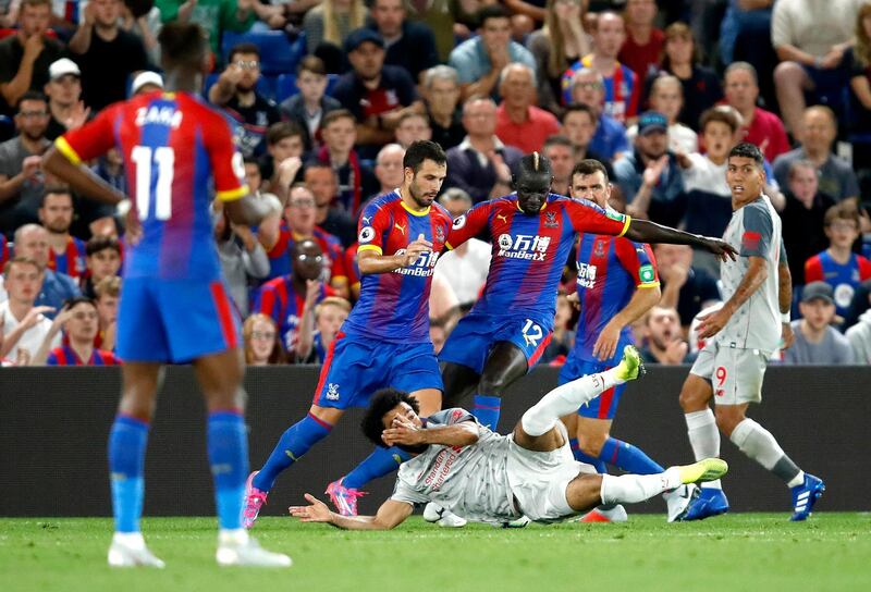 Liverpool forward Mohamed Salah falls to the ground to win his team a penalty against Crystal Palace. Getty Images