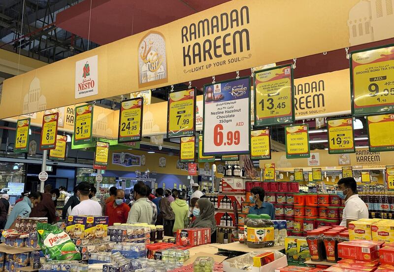 AJMAN, UNITED ARAB EMIRATES , April 23– 2020 :- People wearing protective face mask as a preventive measure against coronavirus and doing shopping for Ramadan at the Nesto supermarket in Ajman.  (Pawan Singh / The National) For News/Standalone/Online/Instagram. Story by Salam