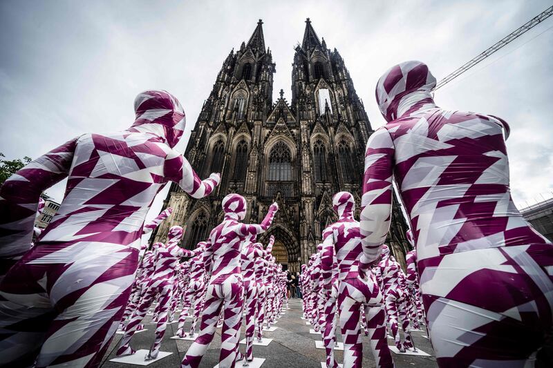 An art installation called Shattered Souls . . .  In A Sea Of Silence by German artist Dennis Josef Meseg outside Cologne Cathedral in western Germany. AFP