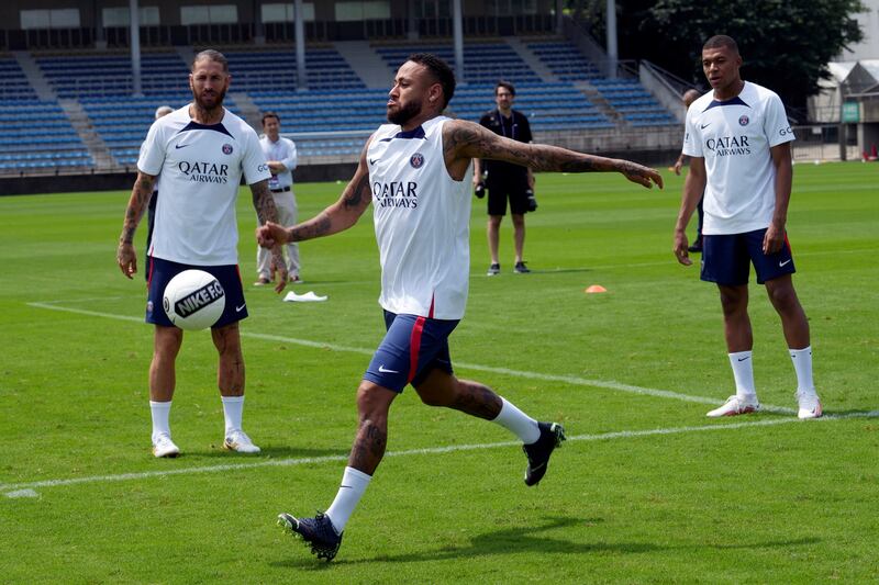 Paris Saint-Germain's Sergio Ramos, Neymar and Kylian Mbappe play with the ball. AP Photo 