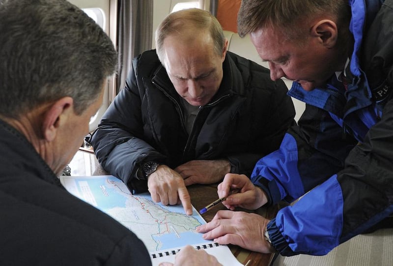 Russian president Vladimir Putin looks at a map of the Crimean Peninsula. Syria is not the first example of Russia playing politics across a country's territory (Photo: EPA/Mikhail Klimentyev/Sputnik/Kremlin Pool)