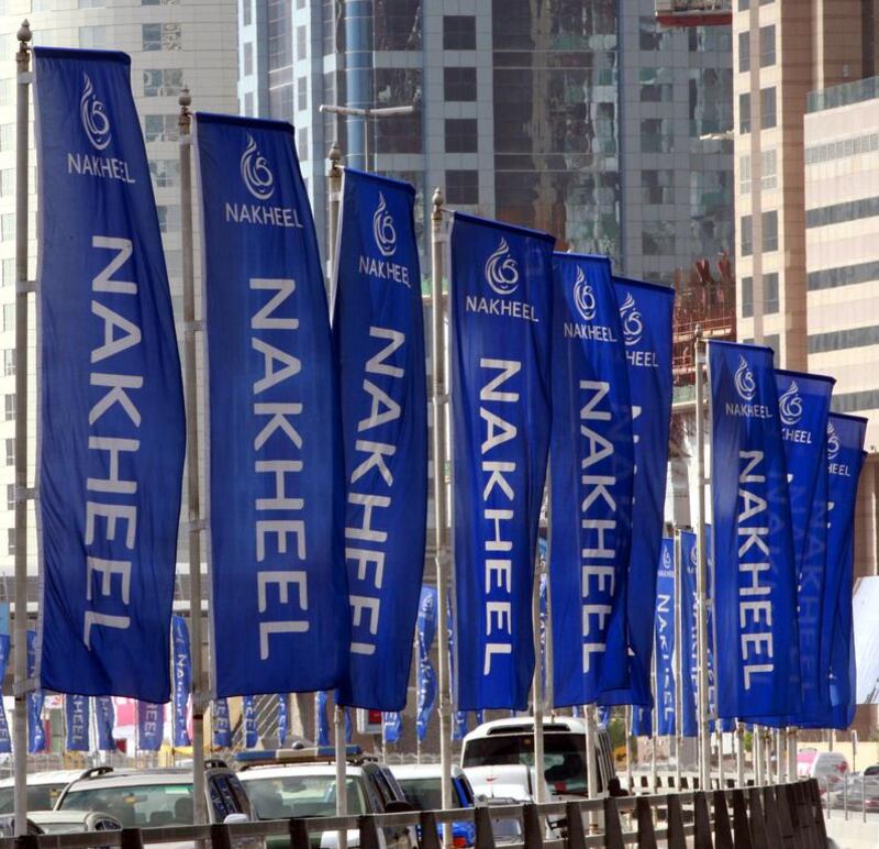Flags for the property company Nakheel on the Sheik Zayed highway in Dubai. Mosab Omar / Reuters