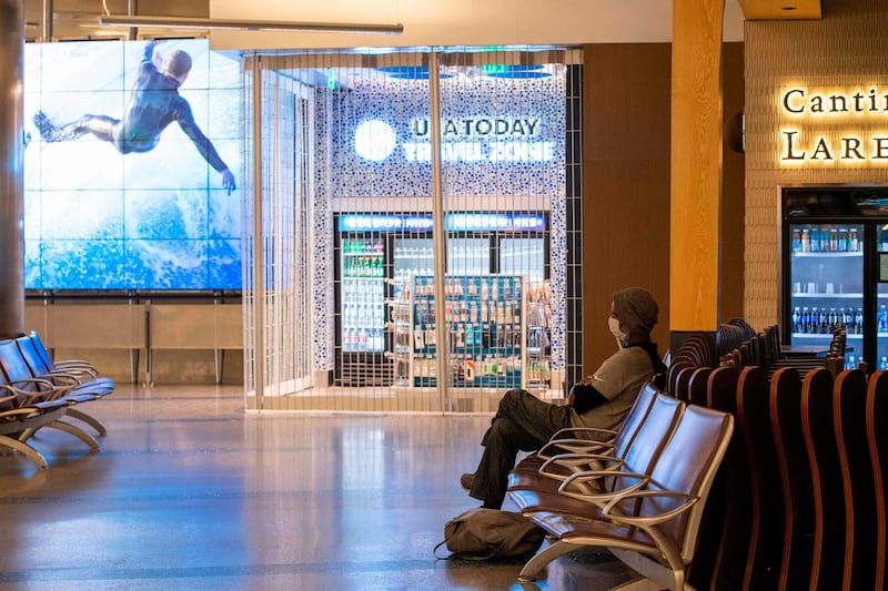 A person waits for a flight at the Tom Bradley Terminal at Los Angeles International Airport in Los Angeles. AFP