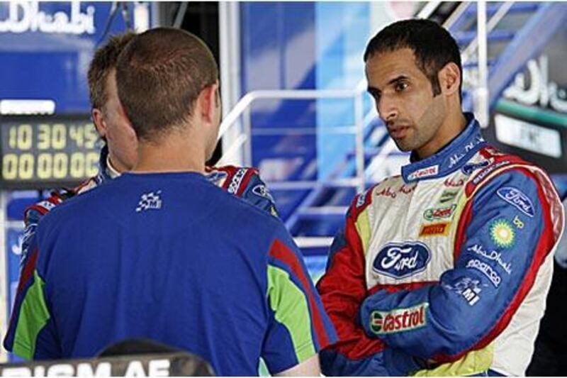 BP Ford Abu Dhabi team driver Khalid al Qassimi talks with his team mechanics as he looks to get the most of his car coming back from a  45-day rest period and striving for a personal best time in Finland.