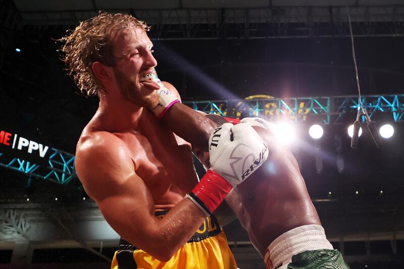 Floyd Mayweather exchanges blows with Logan Paul during their exhibition bout at Hard Rock Stadium. AFP