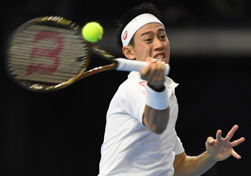 Kei Nishikori of Japan hits the return during his men's singles second round match against France's Benoit Paire at the Japan Open tennis championships in Tokyo on October 3, 2018. / AFP / TOSHIFUMI KITAMURA
