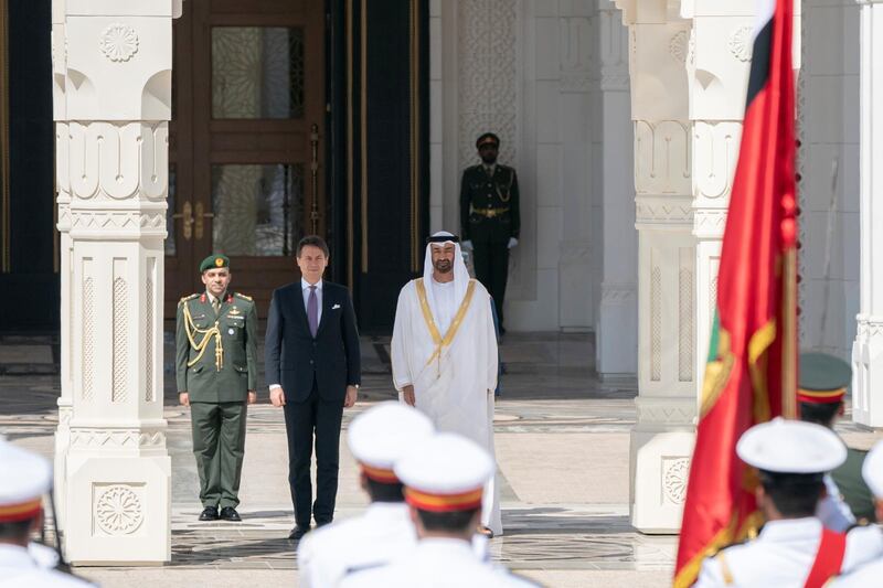 ABU DHABI, UNITED ARAB EMIRATES - November 15, 2018: HH Sheikh Mohamed bin Zayed Al Nahyan Crown Prince of Abu Dhabi Deputy Supreme Commander of the UAE Armed Forces (center R) and HE Giuseppe Conte, Prime Minister of Italy (center 2nd R), stand for the national anthem, during a reception held at the Presidential Palace.

( Rashed Al Mansoori / Ministry of Presidential Affairs )
---