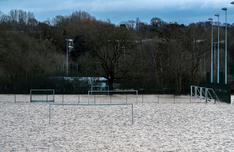 A flooded school playing field in Didsbury, north west England, Thursday Jan. 21, 2021. Almost the whole of England, Wales and Northern Ireland are subject to weather warnings for rain until Thursday morning. (Peter Byrne/PA via AP)