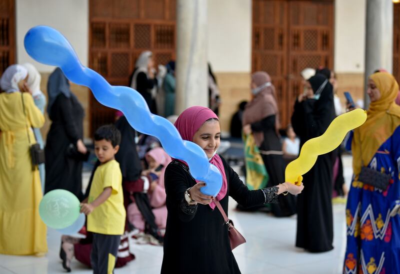 Children play after Eid Al Adha prayers in Al Azhar Mosque in Cairo, Egypt, on July 20, 2021.