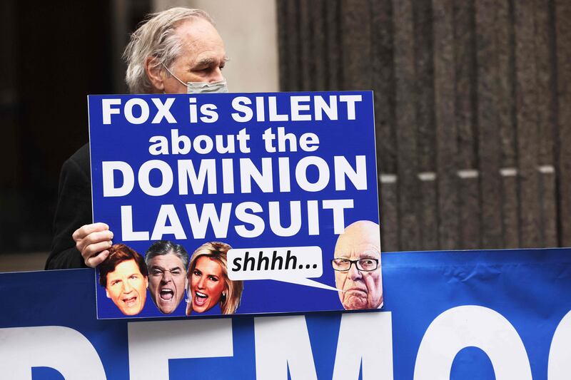 Members of Rise and Resist participate in their weekly "Truth Tuesday" protest at News Corp headquarters on February 21, in New York City. Getty Images via AFP