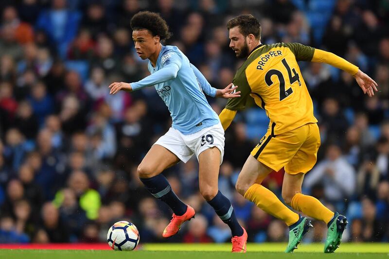 MANCHESTER, ENGLAND - MAY 09:  Leroy Sane of Manchester City gets past Davy Propper of Brighton & Hove Albion during the Premier League match between Manchester City and Brighton and Hove Albion at Etihad Stadium on May 9, 2018 in Manchester, England.  (Photo by Mike Hewitt/Getty Images)