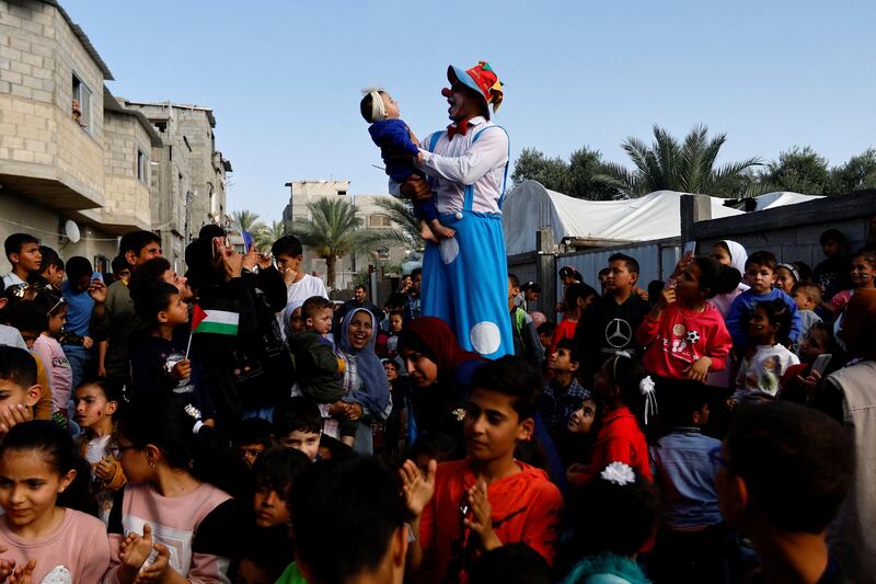 A Palestinian clown  entertains children in the Gaza Strip. Reuters