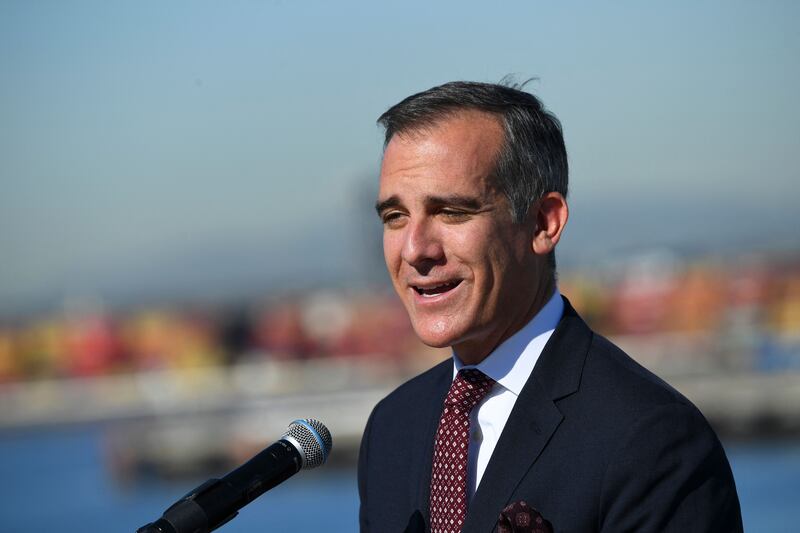 Los Angeles Mayor Eric Garcetti speaks after a tour of the Ports of Los Angeles and Long Beach during a press conference at the port of Long Beach on January 11, 2022. AFP