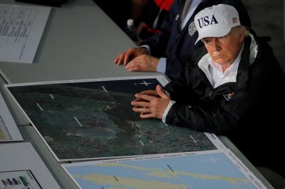 U.S. President Donald Trump receives a briefing on Tropical Storm Harvey relief efforts in Corpus Christi, Texas, U.S., August 29, 2017. REUTERS/Carlos Barria