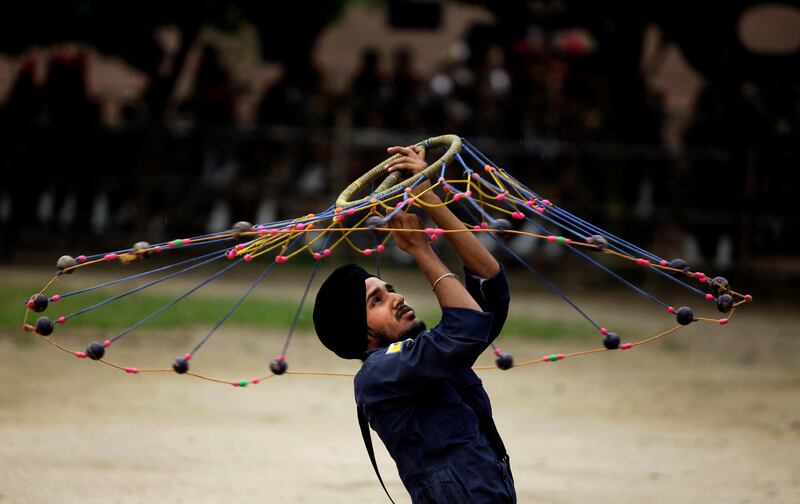 An Indian Sikh student performs Gatka, an Indian form of martial art, during Independence Day celebrations in Jammu, India, Monday, Aug. 15, 2011. India marked 64 years of independence from British rule. (AP Photo/Channi Anand) *** Local Caption ***  India Independence day.JPEG-0ab59.jpg