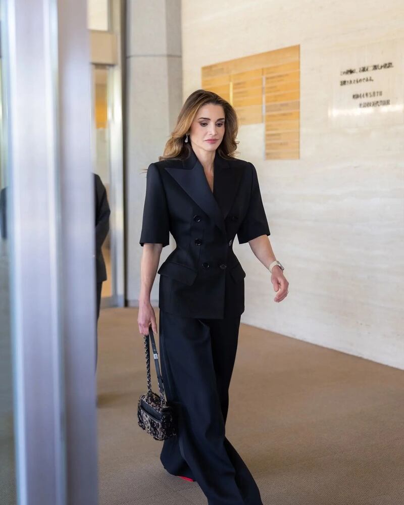 The royal at the National Museum of Modern Art in Tokyo, wearing a black tailored suit by French label Alexandre Vauthier