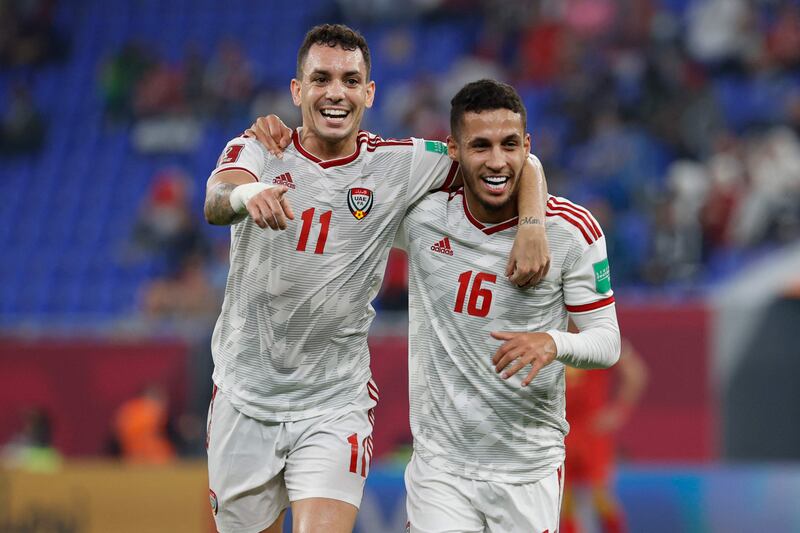 UAE forward Caio Canedo celebrates with teammate Ali Saleh, after opening the scoring against Syria. Both were on target in the 2-1 win in UAE's opening Group B match of the Fifa Arab Cup 2021 at the Ras Abu Aboud Stadium in Doha on November 30, 2021. AFP
