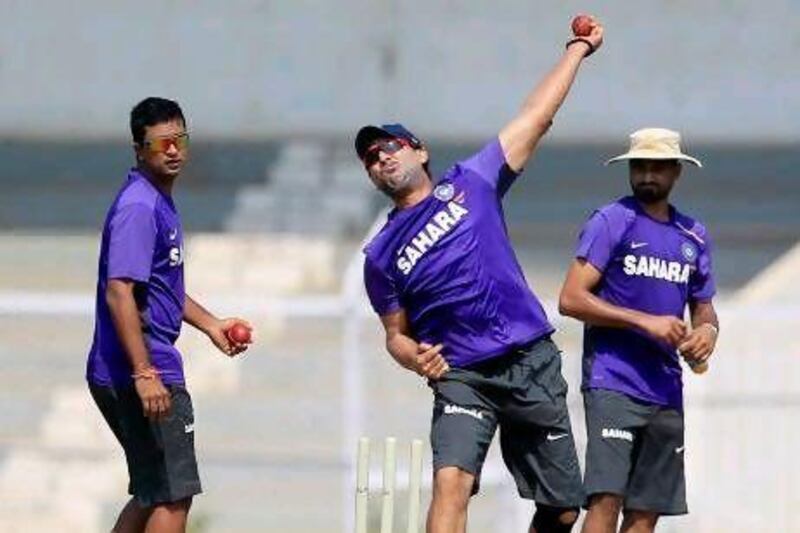 Indian cricket players, from left, Pragyan Ojha, Yuvraj Singh and Harbhajan Singh, attend a practice session in Mumbai ahead of the Test with England.