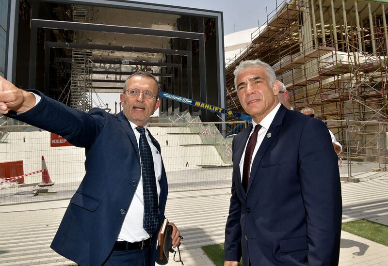 A handout picture released by Israeli Government Press Office shows Elazar Cohen, commissioner general of the Israel Pavilion at Expo 2020 Dubai, with Yair Lapid. Shlomi Amsalem / GPO / AFP