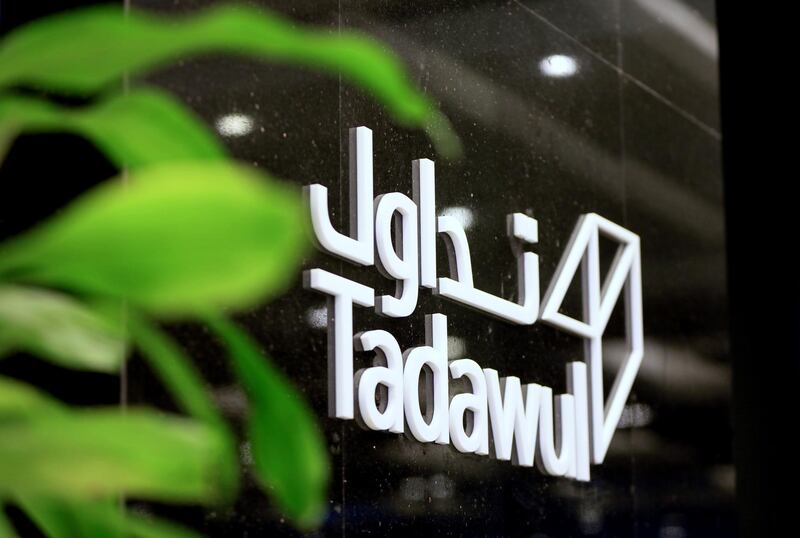 A logo in Arabic and English sits on display at the entrance to the Saudi Stock Exchange, also known as Tadawul, in Riyadh, Saudi Arabia, on Sunday, Nov. 4, 2018. A month after the murder of government critic Jamal Khashoggi in the Saudi consulate in Istanbul, bankers say the rewards of doing business with the oil-rich kingdom far outweigh the risks. Photographer: Mohammed Almuaalemi/Bloomberg