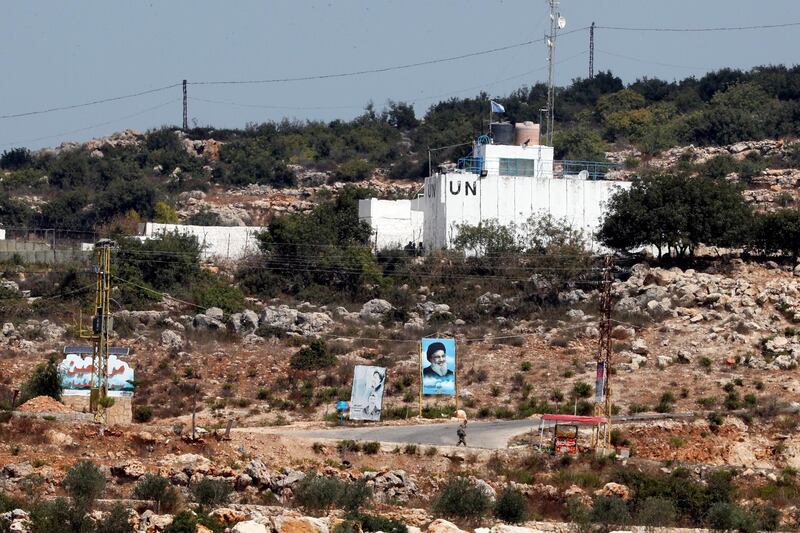 A banner depicting Hezbollah leader Sayyed Hassan Nasrallah and an United Nation's post are seen in Lebanon from the Israeli side of the border, near Zar'it in northern Israel August 28, 2019. REUTERS/Ammar Awad