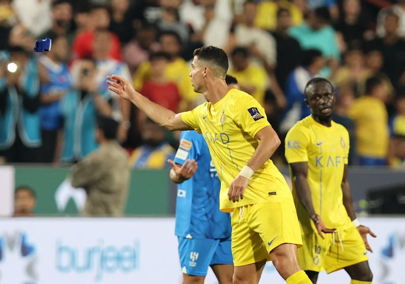 Al Nassr's Cristiano Ronaldo throws the captain's armband after being shown a red card by referee Mohammed Al Hoaish. Reuters