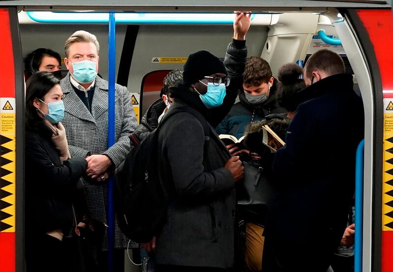 Commuters wait for their train to depart from Victoria tube station on Januer 14. AFP