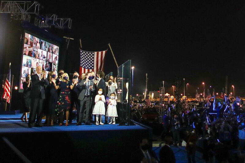 President-elect Joe Biden and Vice President-elect Kamala Harris and their families watch fireworks from stage after delivering remarks in Wilmington, Delaware.  AFP