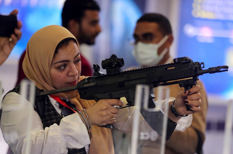 A visitor holds a weapon at Edex. Reuters