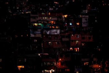 Partial view of the Caracas neighborhood Petare hill - where electric power has been restored - on March 10, 2019, during the third day of a massive power outage which has left the capital and much of the country without communications, water and electricity. AFP