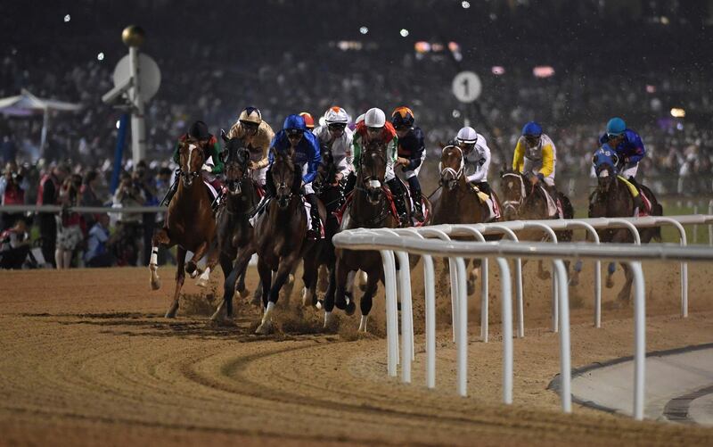 Horses gallop into the first turn of the $12 million Group 1 Dubai World Cup over 2000m with the eventual winner Thunder Snow with jockey Christophe Soumillon in the lead, Dubai, United Arab Emirates, Saturday, March 30, 2019. Thunder Snow is the only horse that won two Dubai World Cups in consecutive years. (AP Photo/Martin Dokoupil)