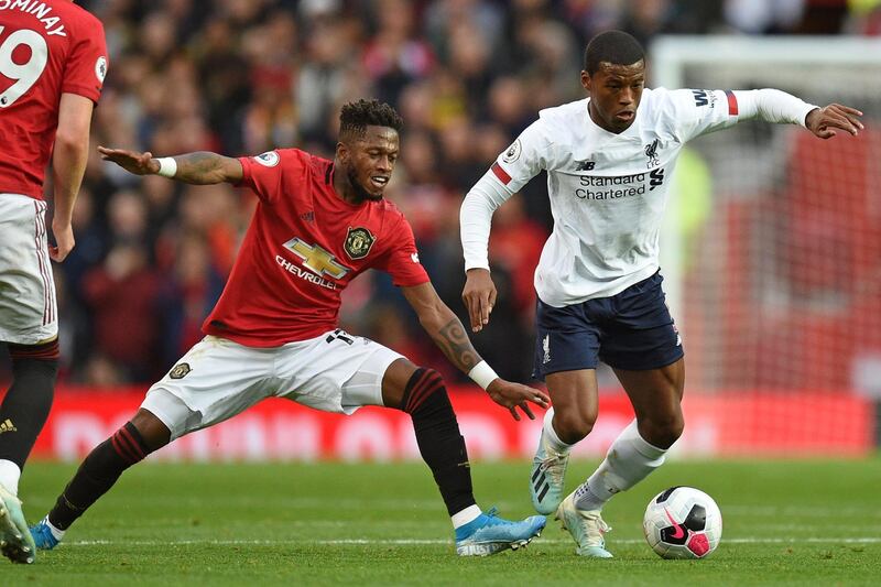 TOPSHOT - Manchester United's Brazilian midfielder Fred (L) vies with Liverpool's Dutch midfielder Georginio Wijnaldum (R) during the English Premier League football match between Manchester United and Liverpool at Old Trafford in Manchester, north west England, on October 20, 2019. RESTRICTED TO EDITORIAL USE. No use with unauthorized audio, video, data, fixture lists, club/league logos or 'live' services. Online in-match use limited to 120 images. An additional 40 images may be used in extra time. No video emulation. Social media in-match use limited to 120 images. An additional 40 images may be used in extra time. No use in betting publications, games or single club/league/player publications.
 / AFP / Oli SCARFF                           / RESTRICTED TO EDITORIAL USE. No use with unauthorized audio, video, data, fixture lists, club/league logos or 'live' services. Online in-match use limited to 120 images. An additional 40 images may be used in extra time. No video emulation. Social media in-match use limited to 120 images. An additional 40 images may be used in extra time. No use in betting publications, games or single club/league/player publications.
