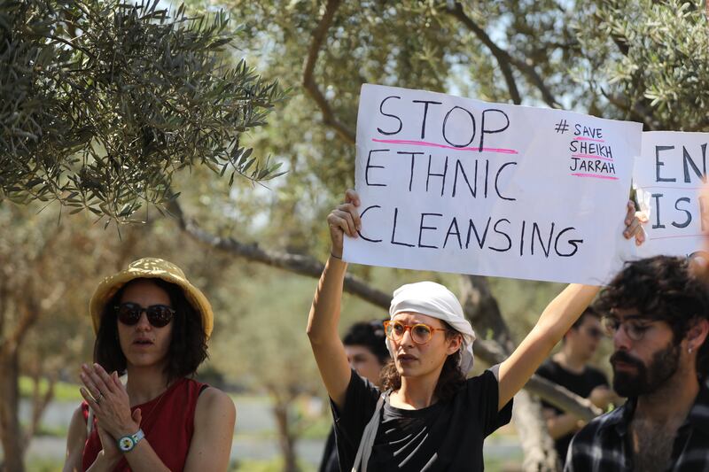 Israeli left-wing activists protest against government policy regarding Palestinians in East Jerusalem outside the Supreme Court in Jerusalem.