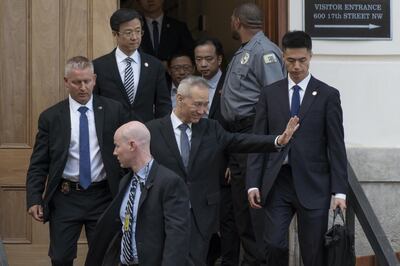 Liu He, China's vice premier, center, waves as he departs the Office of the U.S. Trade Representative in Washington, D.C., U.S., on Thursday, May 9, 2019. The U.S. and China have signaled hardening positions as they prepare for high stakes talks in Washington to avoid an escalation in a year-old trade war that has cast a long shadow over financial markets and the global economy. Photographer: Stefani Reynolds/Bloomberg