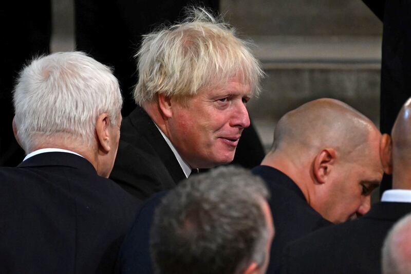 Britain's former prime minister Boris Johnson awaits the arrival of King Charles. Getty Images