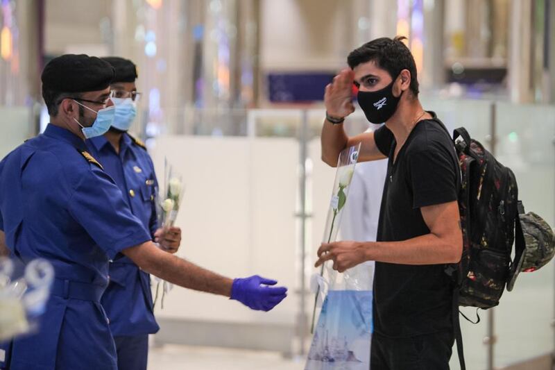 Passengers from Beirut were presented with flowers upon arrival at Dubai International Airport last night. Courtesy: Dubai Customs