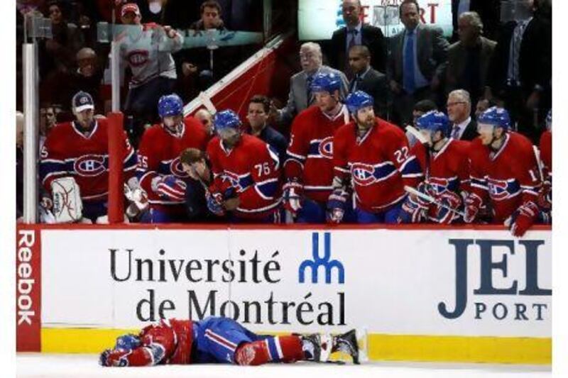 Max Pacioretty lies on the ice after being bodychecked by Zdeno Chara in Montreal. Richard Wolowicz / Getty Images